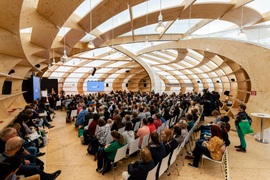 Photo of the inside of the Frankfurt Pavilion Stage with people in the audience.